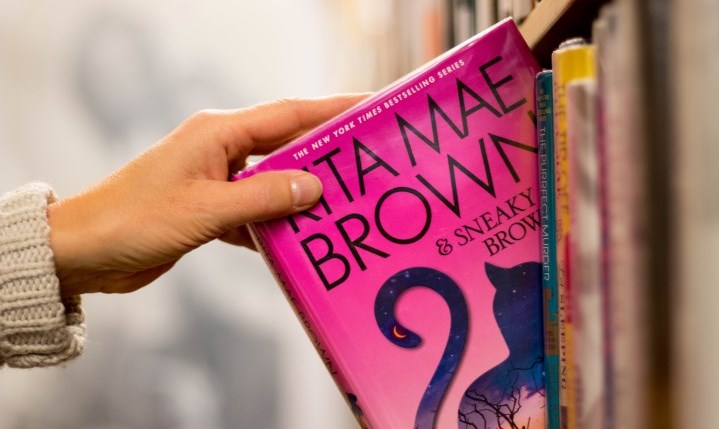 photo of the children's section with text "Imagine, Discover, Connect".